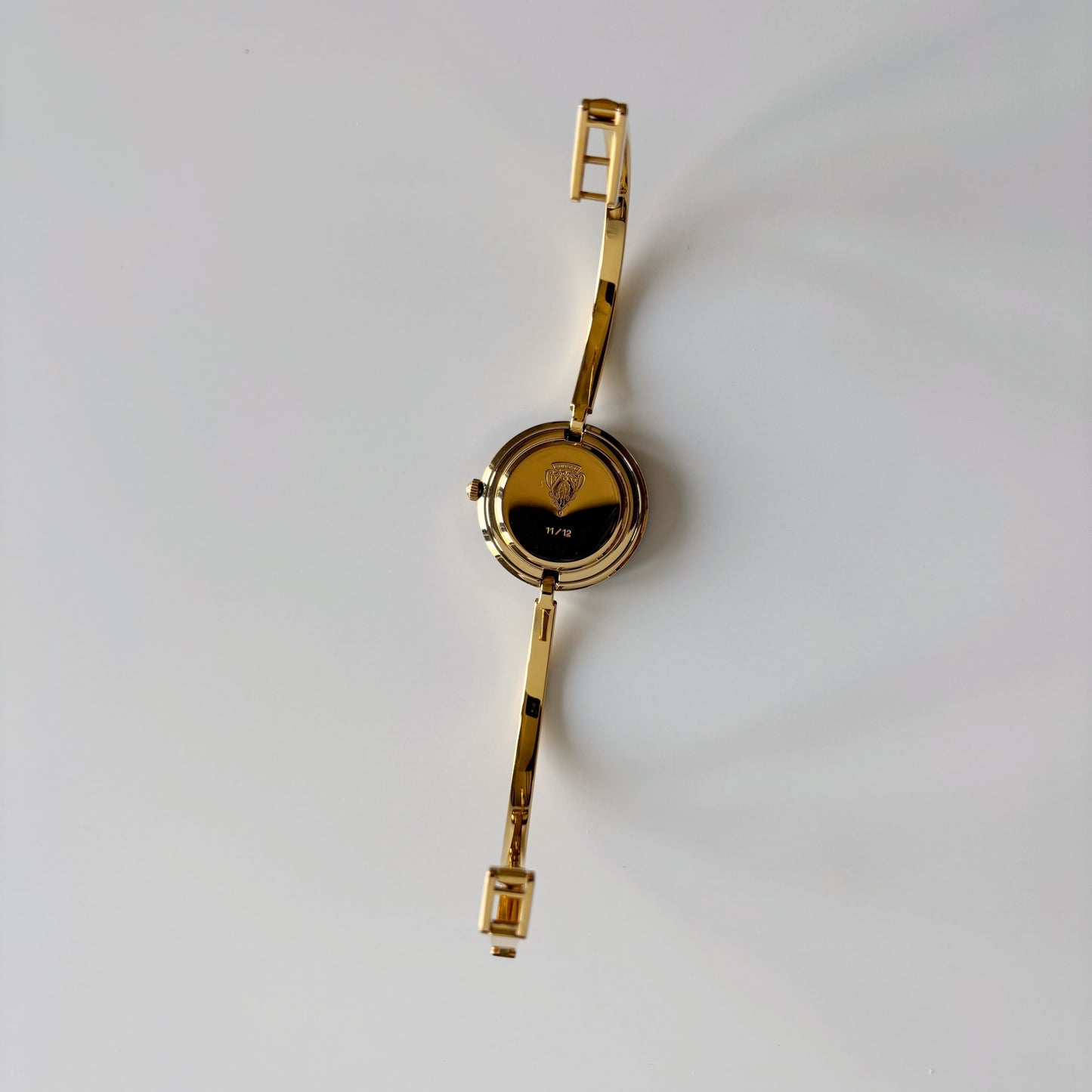 Gucci 1990s Interchangeable Bezel Gold Plated Bangle Watch with 12 bezels, case