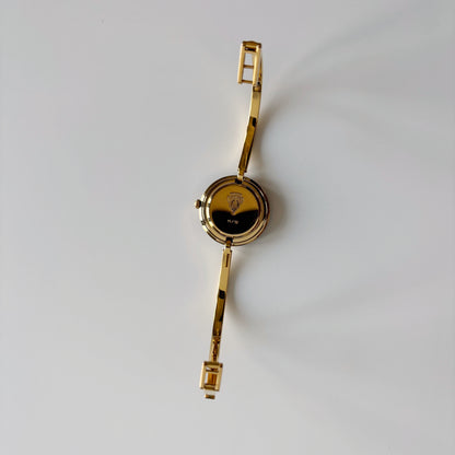 Gucci 1990s Interchangeable Bezel Gold Plated Bangle Watch with 12 bezels, case