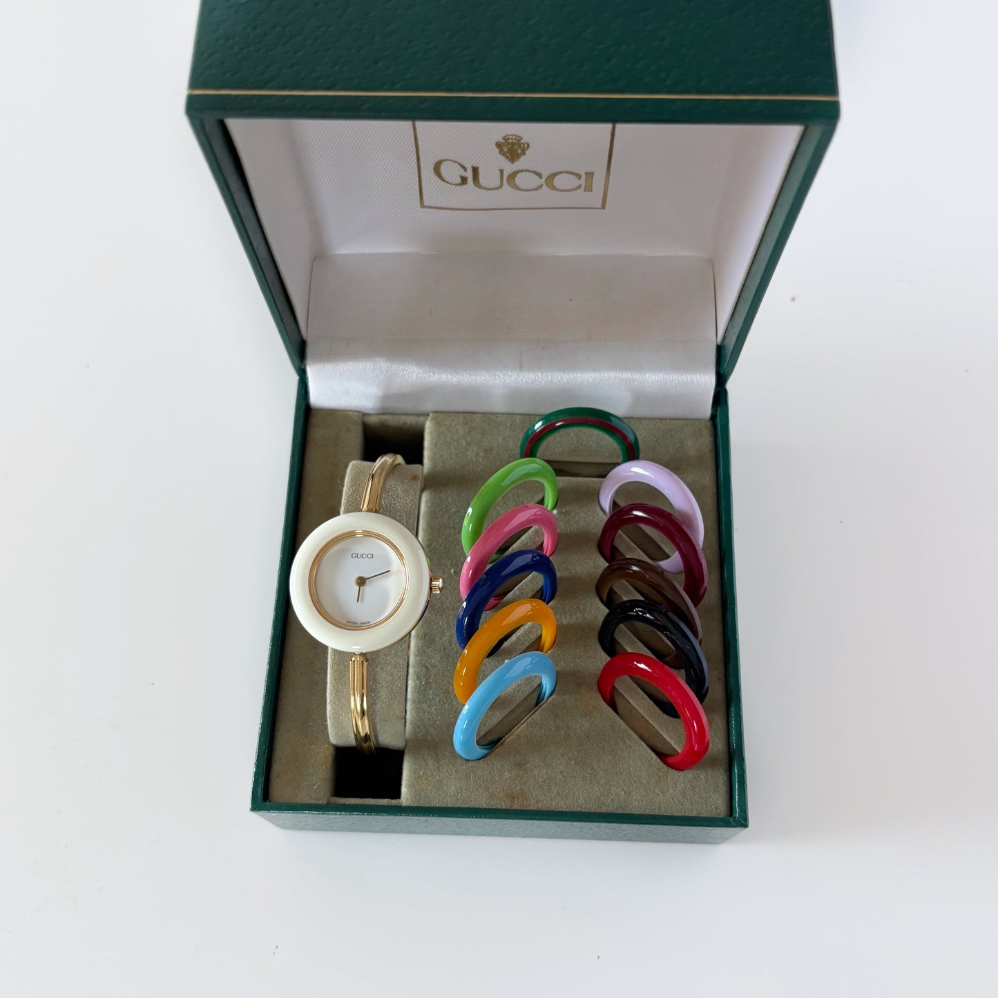 Gucci 1990s Interchangeable Bezel Gold Plated Bangle Watch with 12 bezels, case