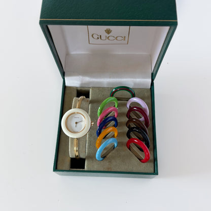 Gucci 1990s Interchangeable Bezel Gold Plated Bangle Watch with 12 bezels, case