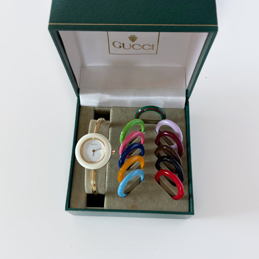 Gucci 1990s Interchangeable Bezel Gold Plated Bangle Watch with 12 bezels, case