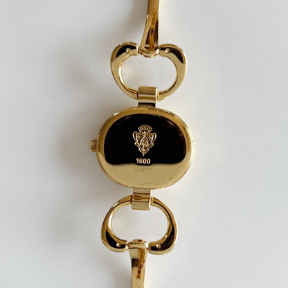 Gucci 1990s Oval Black Dial Gold Plated Bangle Watch (Small)