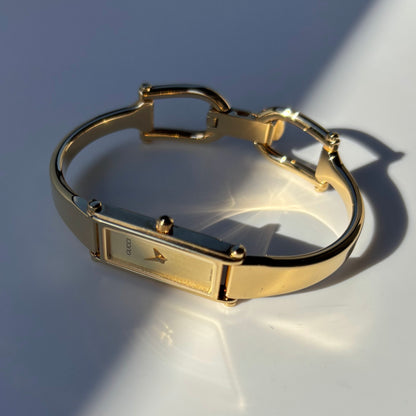 Gucci 1990s Rectangular Dial Gold Plated Bangle Watch