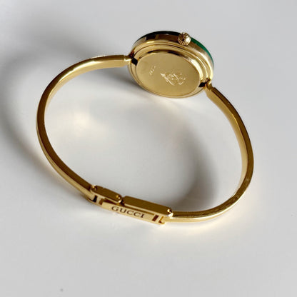 Gucci 1990s Interchangeable Bezel Gold Plated Bangle Watch with 12 bezels, case