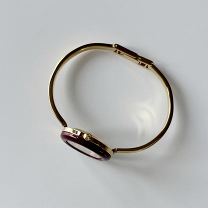 Gucci 1990s Interchangeable Bezel Gold Plated Bangle Watch with 12 bezels, case