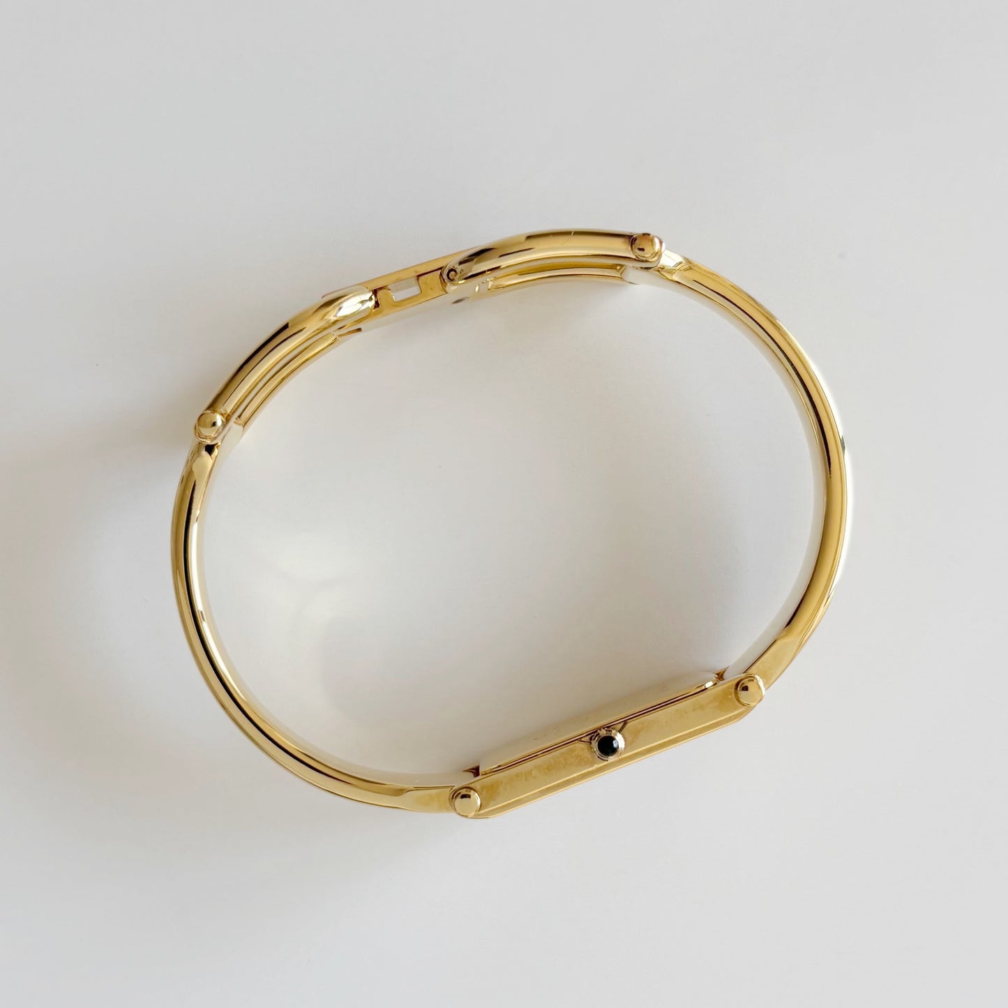 Gucci 1990s Rectangular Gold Dial Gold Plated Bangle Watch