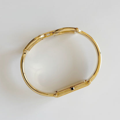 Gucci 1990s Rectangular Gold Dial Gold Plated Bangle Watch