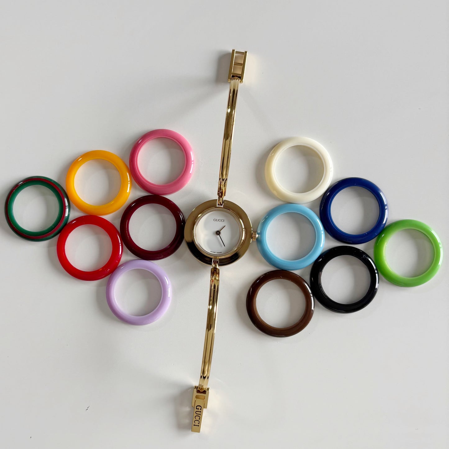 Gucci 1990s Interchangeable Bezel Gold Plated Bangle Watch with 12 bezels, case