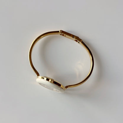 Gucci 1990s Interchangeable Bezel Gold Plated Bangle Watch with case, 12 bezels (Small)