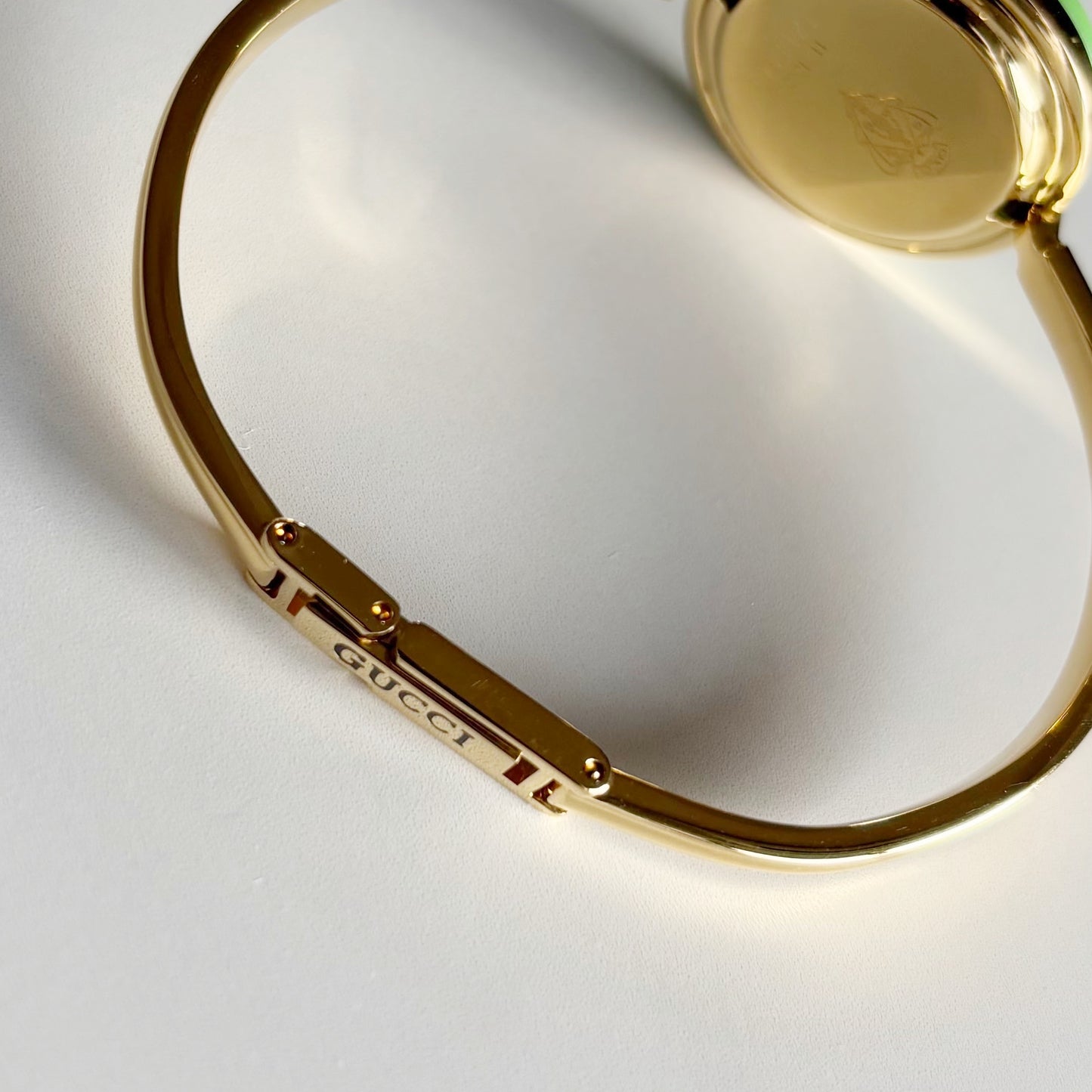 Gucci 1990s Interchangeable Bezel Gold Plated Bangle Watch with 12 bezels, case