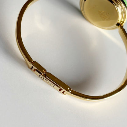 Gucci 1990s Interchangeable Bezel Gold Plated Bangle Watch with 12 bezels, case
