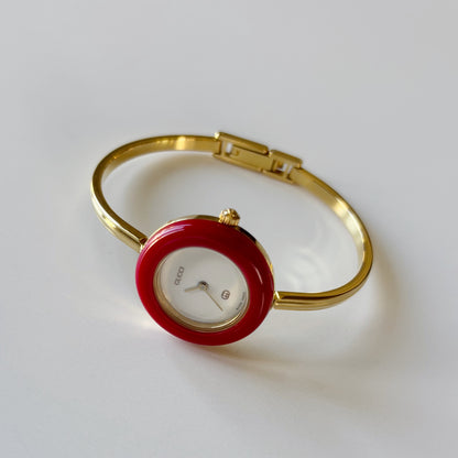 Gucci 1990s Interchangeable Bezel Gold Plated Bangle Watch with 12 bezels, case
