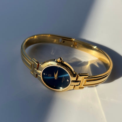 Givenchy 1990s Navy Round Dial Gold Plated Bangle Watch