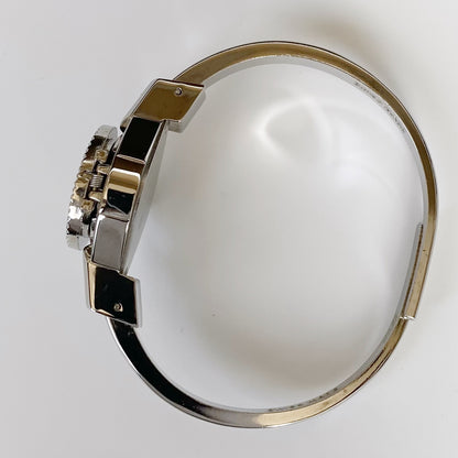 André Mouche Early 2000s Peek-A-Boo Silver Bangle Watch