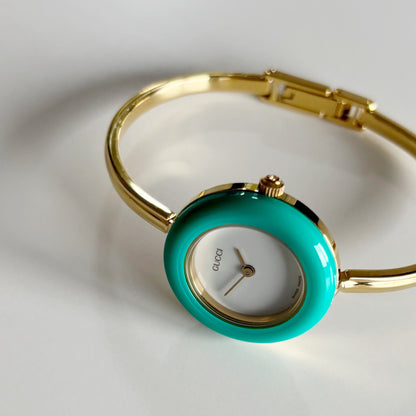 Gucci 1990s Interchangeable Bezel Gold Plated Bangle Watch with 12 bezels, case