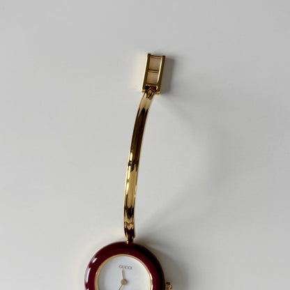 Gucci 1990s Interchangeable Bezel Gold Plated Bangle Watch with 12 bezels, case