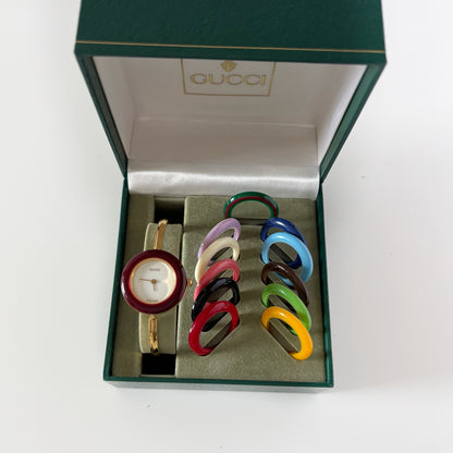 Gucci 1990s Interchangeable Bezel Gold Plated Bangle Watch with 12 bezels, case