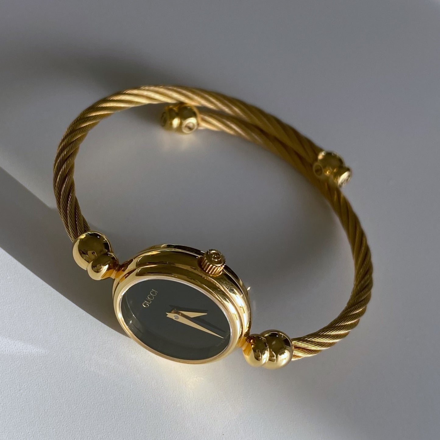 Gucci 1990s Black Dial Gold Plated Bangle Watch