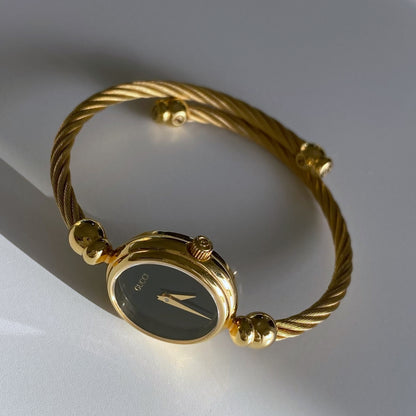 Gucci 1990s Black Dial Gold Plated Bangle Watch