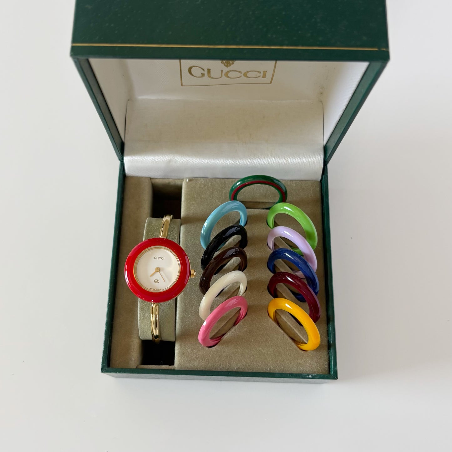 Gucci 1990s Interchangeable Bezel Gold Plated Bangle Watch with case, 12 bezels (Small)