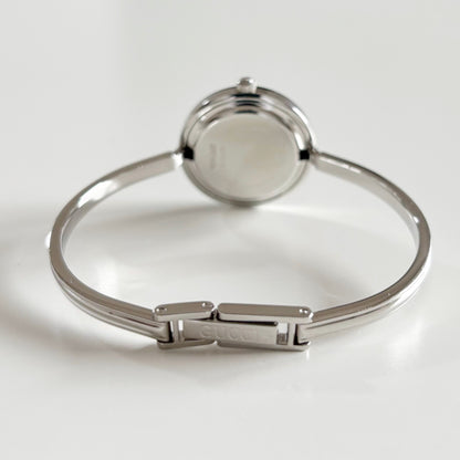 Gucci 1990s Interchangeable Bezel Stainless steel Bangle Watch with 12 bezels, case