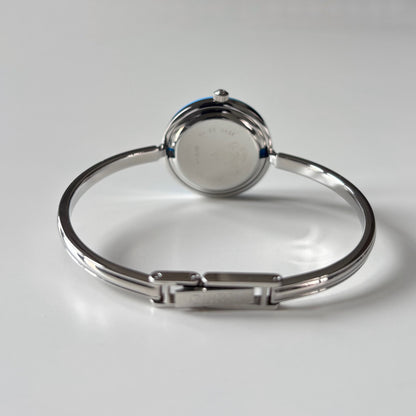 Gucci 1990s Interchangeable Bezel Silver Stainless steel Bangle Watch with 12 bezels, case