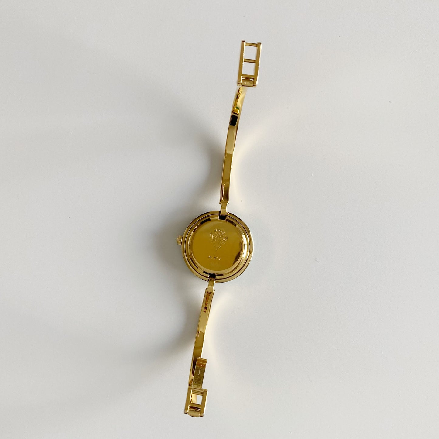 Gucci 1990s Interchangeable Bezel Gold Plated Bangle Watch with 12 bezels, case