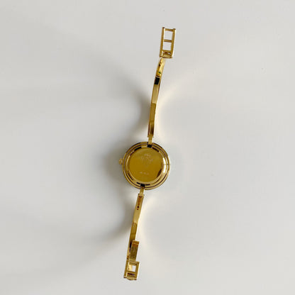Gucci 1990s Interchangeable Bezel Gold Plated Bangle Watch with 12 bezels, case