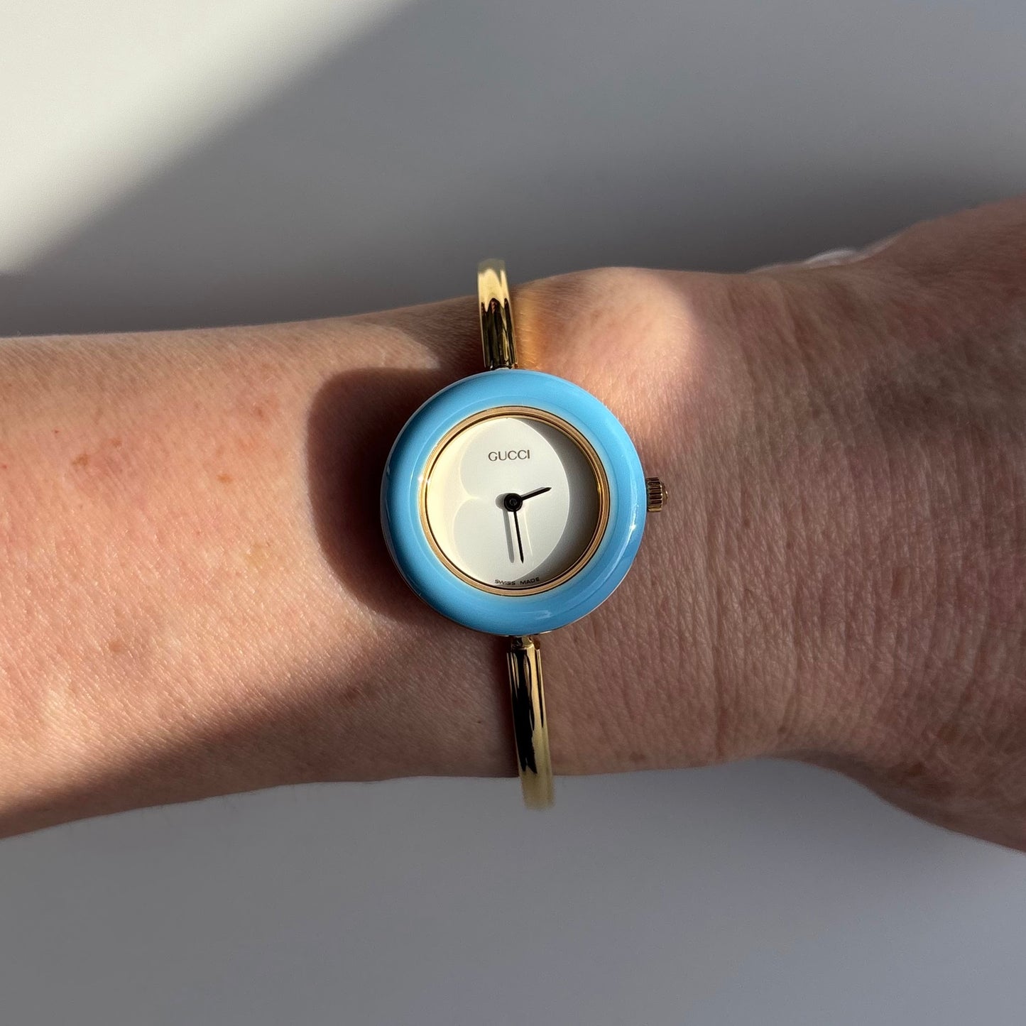 Gucci 1990s Interchangeable Bezel Gold Plated Bangle Watch with 12 bezels, case