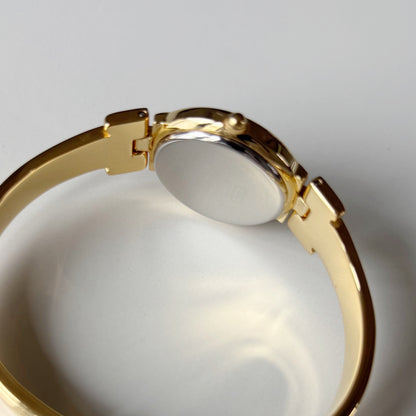 Givenchy 1990s Round Dial Gold Plated Bangle Watch
