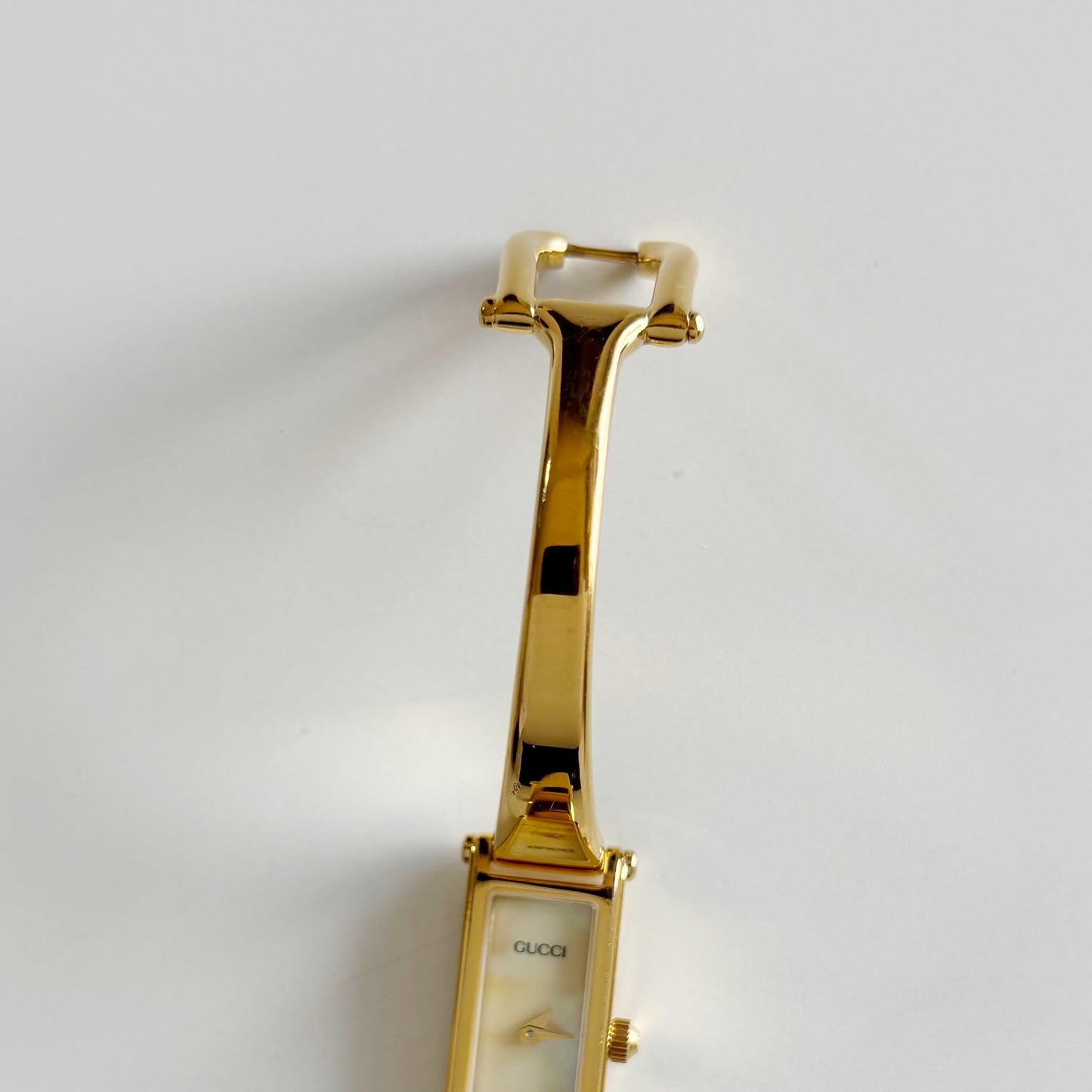 Gucci 1990s Rectangular Seashell Dial Gold Plated Bangle Watch