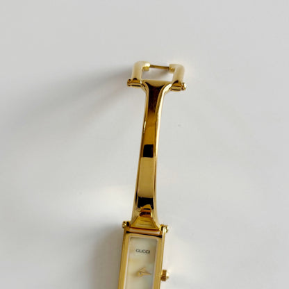Gucci 1990s Rectangular Seashell Dial Gold Plated Bangle Watch