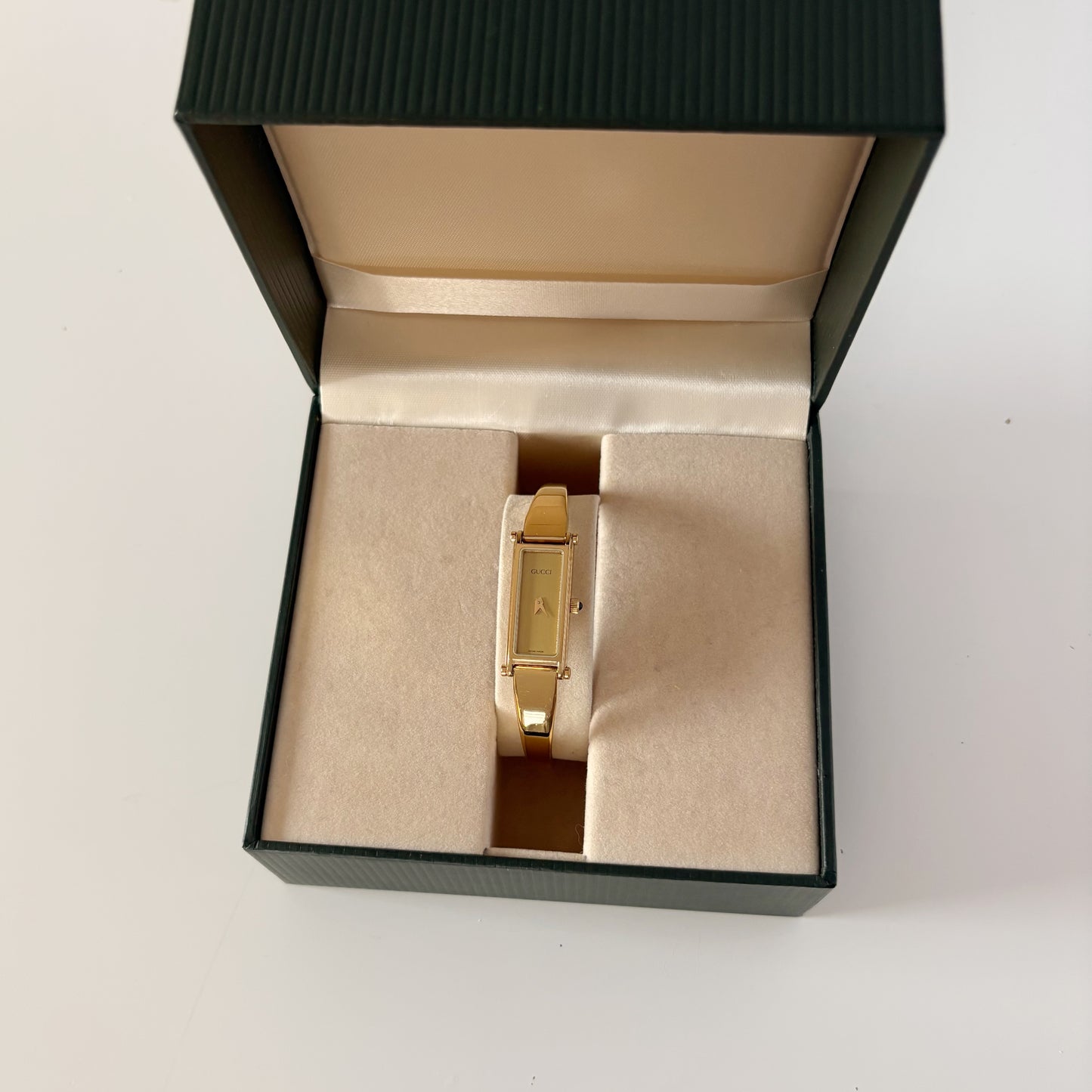 Gucci 1990s Gold Rectangular Dial Gold Plated Bangle Watch