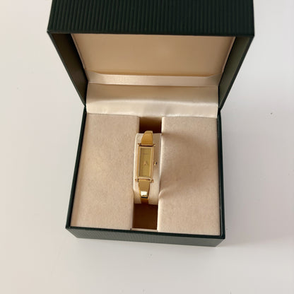 Gucci 1990s Gold Rectangular Dial Gold Plated Bangle Watch