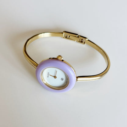 Gucci 1990s Interchangeable Bezel Gold Plated Bangle Watch with 12 bezels, case