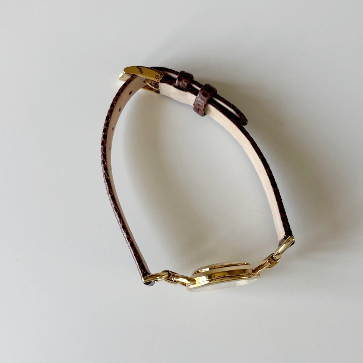 Gucci 1990s Round Cream Dial Horsebit Gold Plated Watch