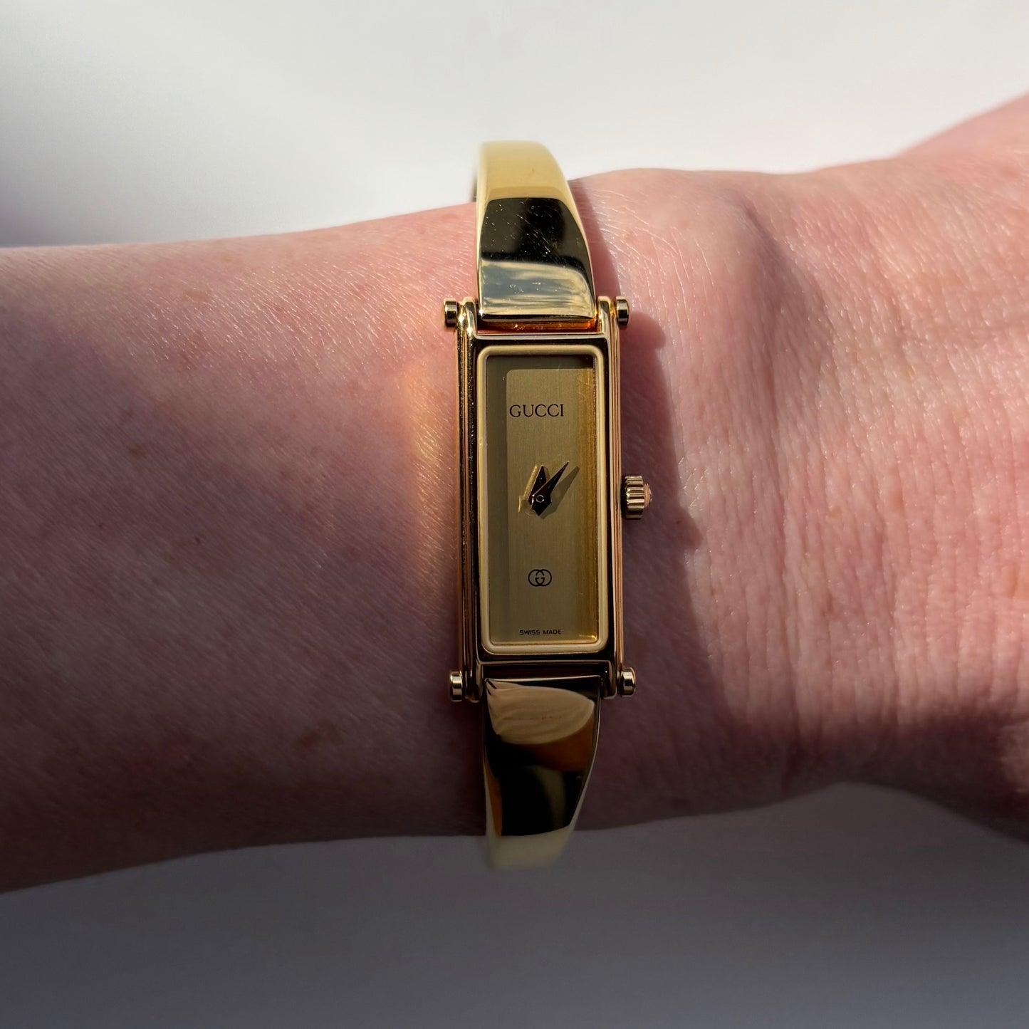 Gucci 1980s Rectangular Gold Dial Gold Plated Bangle Watch