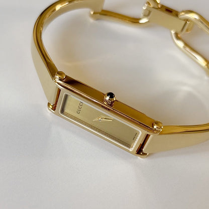 Gucci 1990s Rectangular Gold Dial Gold-Plated Watch
