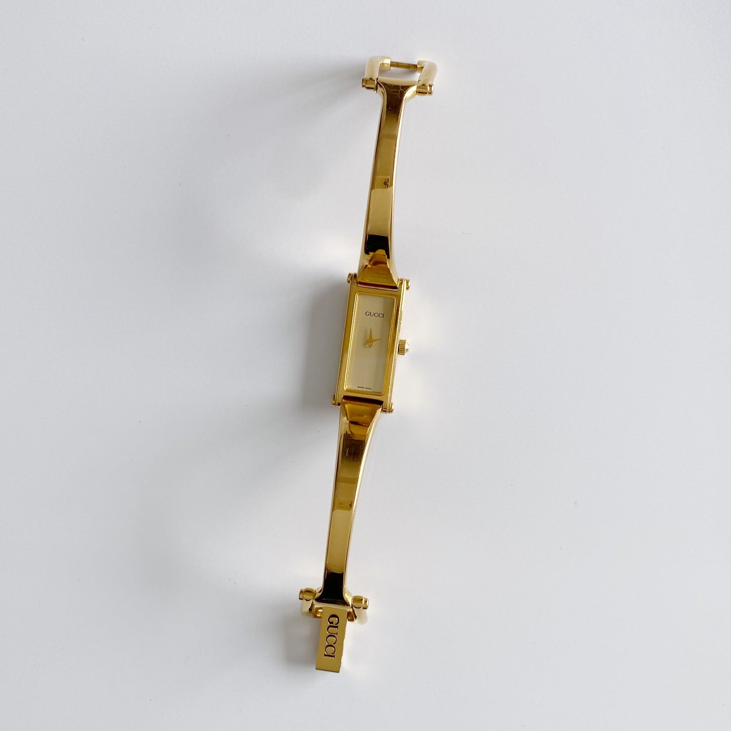 Gucci 1990s Gold Dial Rectangular  Gold Plated Bangle Watch