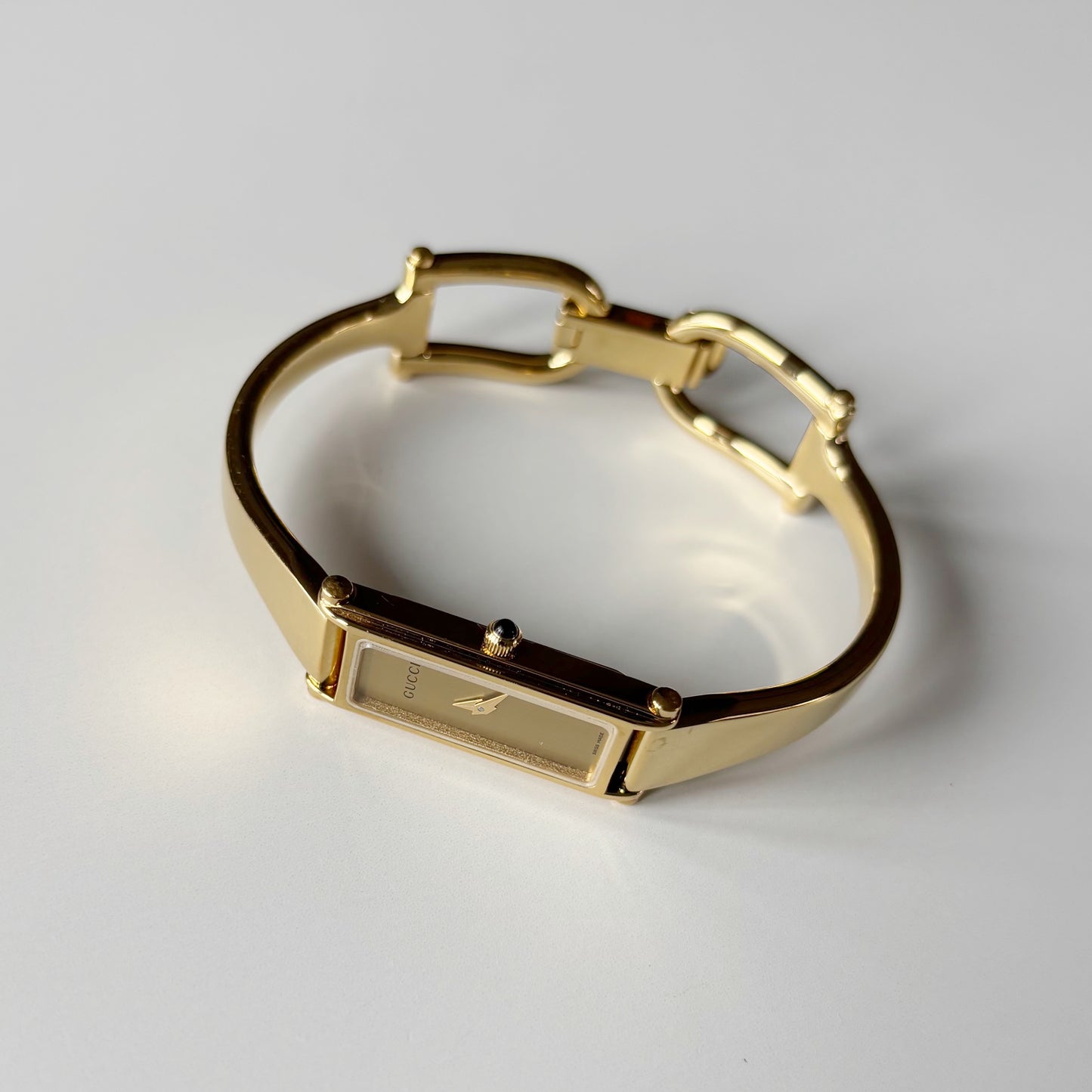 Gucci 1990s Gold Rectangular Dial Gold Plated Bangle Watch