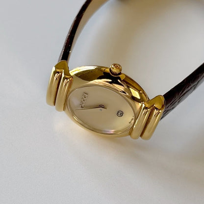 Gucci 1990s Seashell Round Dial Gold Plated Watch