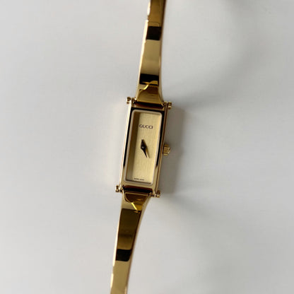 Gucci 1990s Rectangular Gold Dial Gold Plated Bangle Watch (Small)