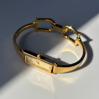 Gucci 1990s Rectangular Seashell Dial Gold Plated Bangle Watch