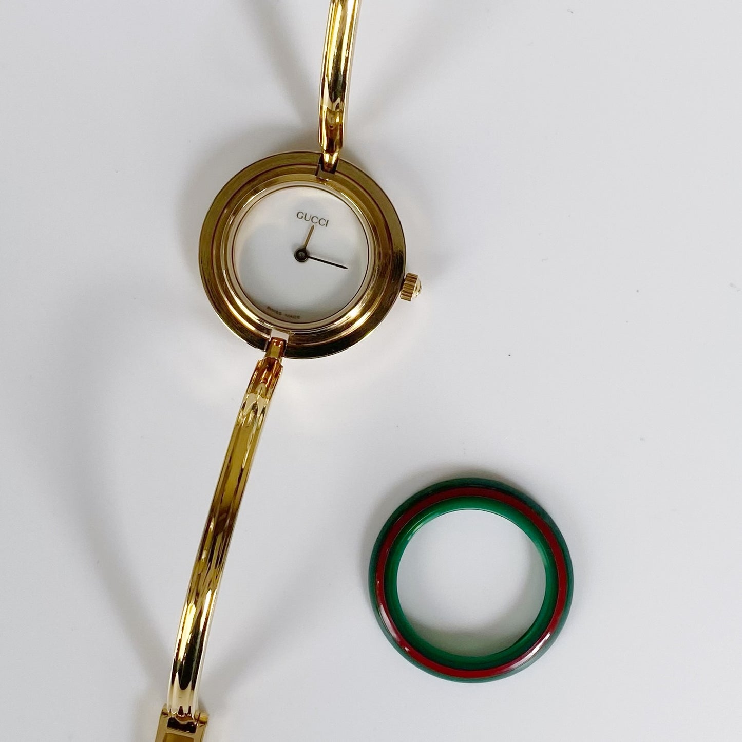 Gucci 1990s Interchangeable Bezel Gold Plated Bangle Watch with 12 bezels, case