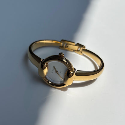 Gucci 1990s Round Dial Gold Plated Bangle Watch