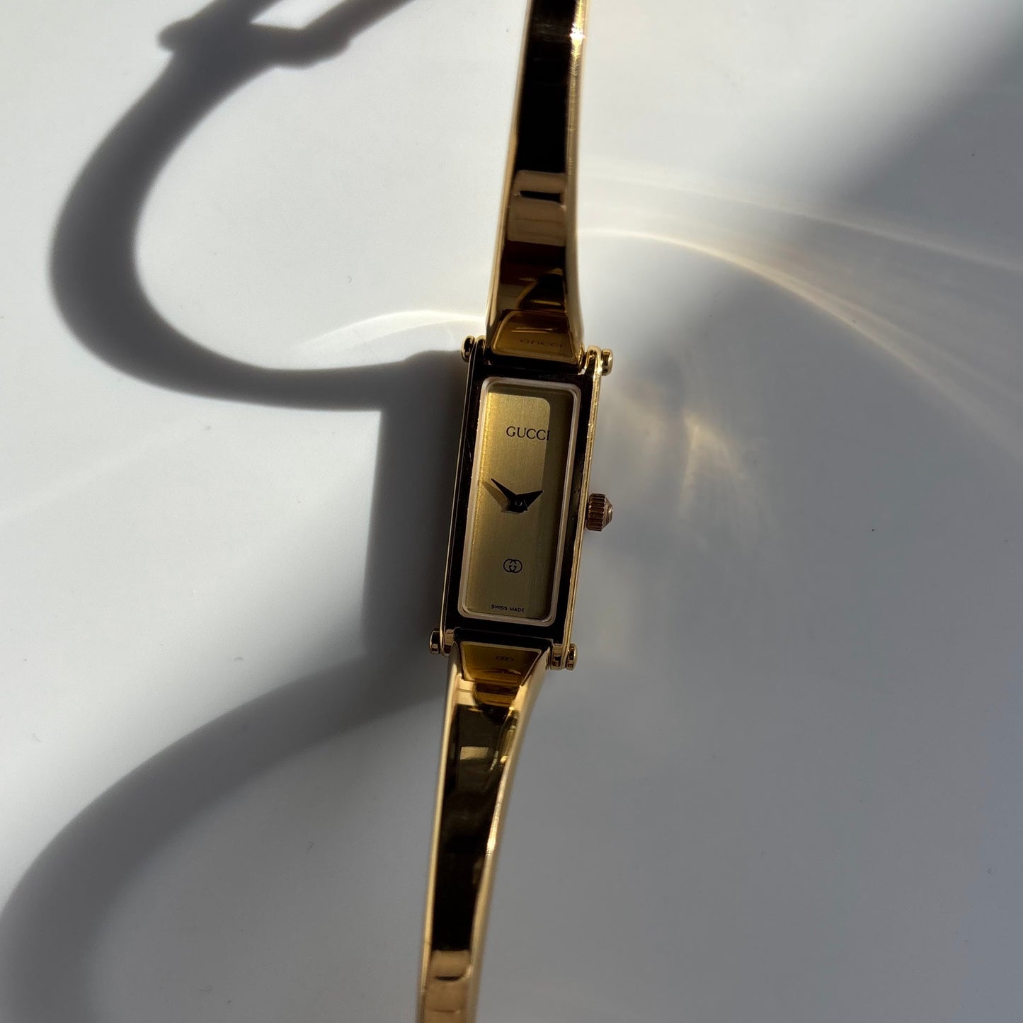 Gucci 1990s Gold Rectangular Dial Gold Plated Bangle Watch