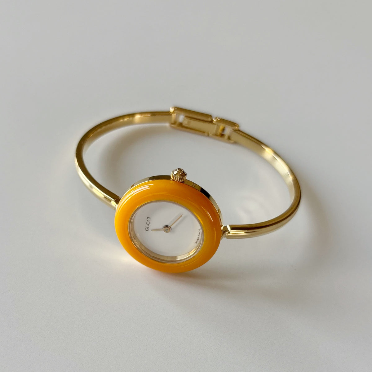 Gucci 1990s Interchangeable Bezel Gold Plated Bangle Watch with 12 bezels, case