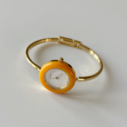 Gucci 1990s Interchangeable Bezel Gold Plated Bangle Watch with 12 bezels, case