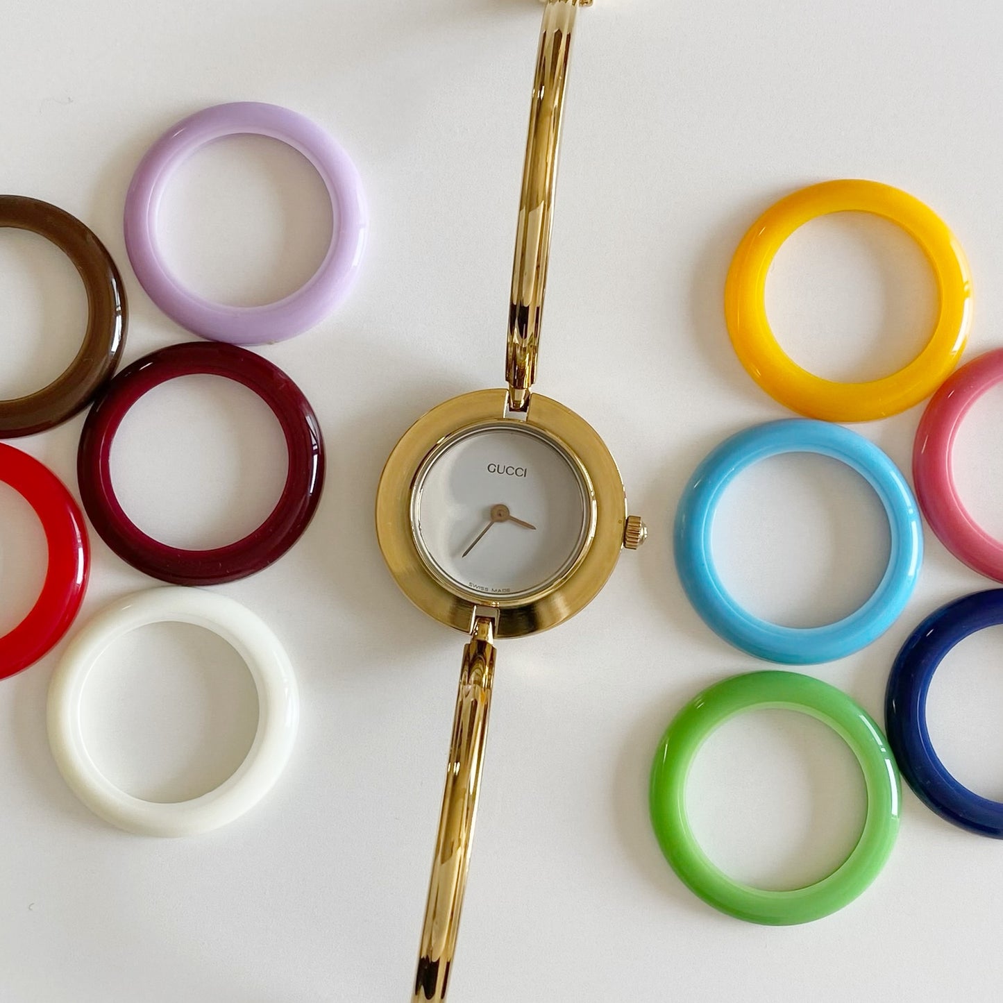 Gucci 1990s Interchangeable Bezel Gold Plated Bangle Watch with 12 bezels, case (Small)