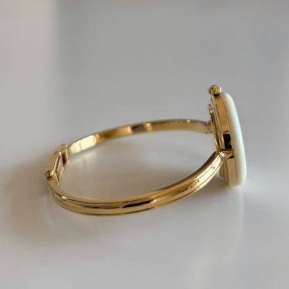 Gucci 1980s Interchangeable Bezel Gold Plated Bangle Watch with 12 bezels, case